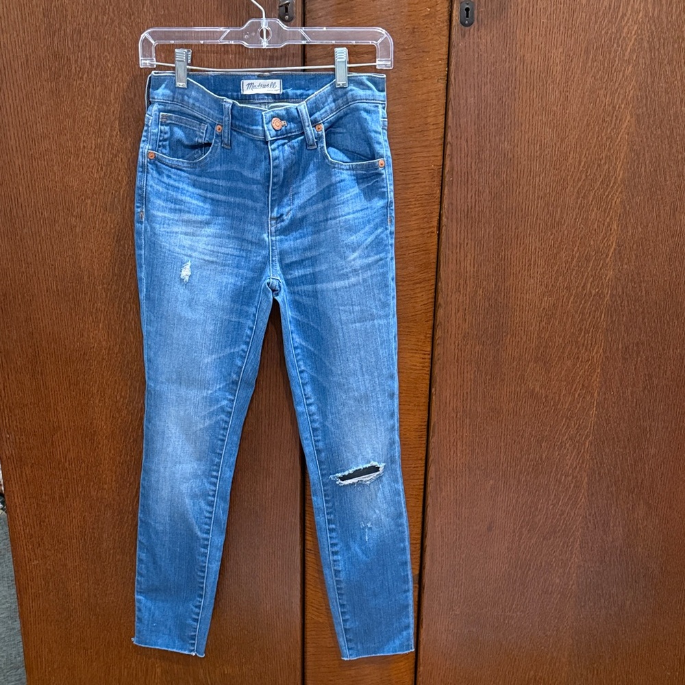 Madewell Medium Wash Blue Distressed Jeans with Raw Hem.